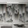 Fototapete Walls by Patel 4 m x 2,7 m 3D Grau Grün Orange Raum 2
